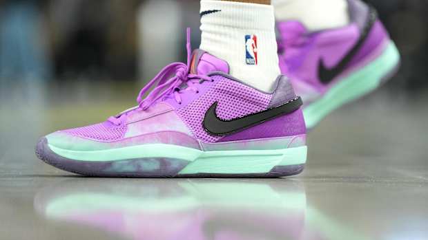 View of Ja Morant's purple and black Nike shoes.
